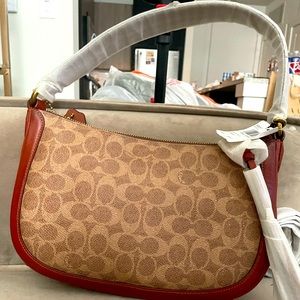 Brand new Coach shoulder bag. Never worn. Tags attached